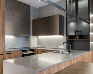 A modern kitchen fitted with wooden cabinets and counter tops by Kitchen Fitters Basingstoke.