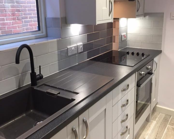 New kitchen faucet and integrated cooker and hob that has been installed in a kitchen in Basingstoke.