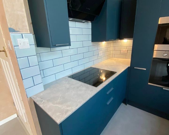 A new kitchen installation featuring white kitchen wall tiling.