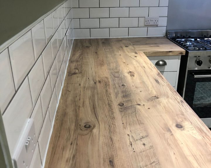 New wooden kitchen worktops installed on some new white kitchen cupboards.